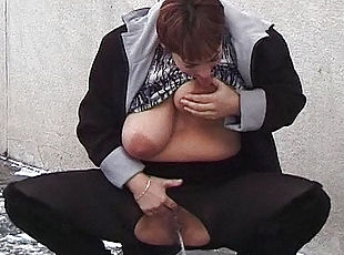 redhead bbw milf peeing on public street while she sucks her big natural breasts