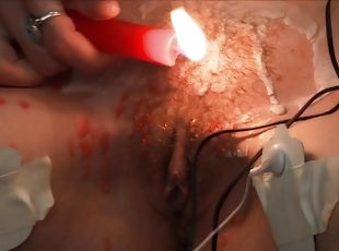 Kinky redhead teen Ava abuses herself with electricity and hot wax