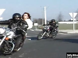 Sexy brunette chick gets it on, outdoors, and on a motorcycle in th...