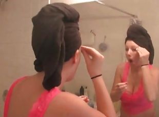 Busty girl does her makeup after shower