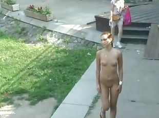 Naked girl with small tits walks the park