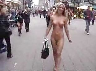 Walking the busy streets totally nude