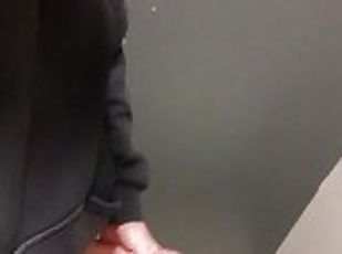 guy in blue jeans jerks off in the airport toilet and cums on the f...
