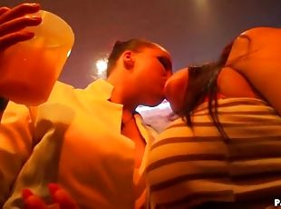 Drunken babes at a club suck on cock
