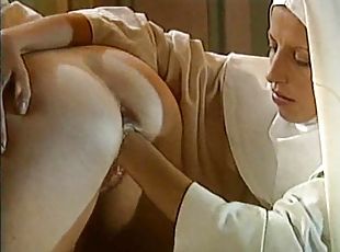 Nun fisting a shaved nun pussy