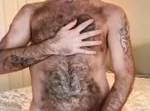 Horny hairy daddy stroking his furry cock before shooting a massive...