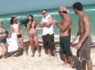Bikini babes shake their sexy asses on the beach