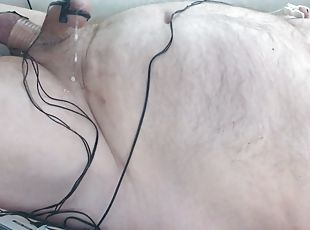 Hands free cumshot. Bound and stretched balls are swollen and shock...