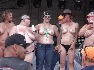 Biker babes topless on stage dancing for the guys