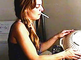 Cute chick smokes around the house