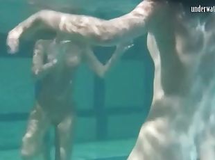 Naked chicks have some fun underwater