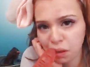 Hot redhead sucks dildo on webcam