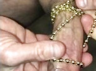 Watch me use a beaded necklace to stimulate my cock while I masturb...