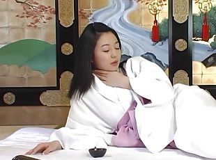 Hairy Asian bitch takes off her robe and gives a blowjob