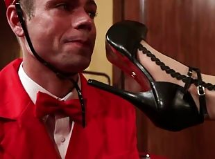 Hotel Guest Maitresse Madeline Dominates the Bellboy in Foot Fetish Video