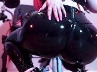 Pink haired Luvie Doll polishing big shiny latex leggings ass in do...