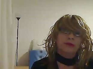 horny MILF tranny in front of the camera simulates a Blowjob while ...