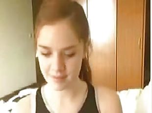 Homemade video of a redhead teen girl exposing her big natural boobs