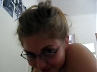 Brown-haired girlfriend with glasses sucking a big dick