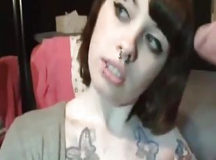 Tattooed and pierced chick sucking her BF's cock