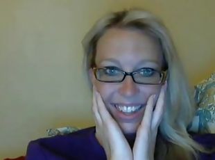 Sexy blonde nerd stripteasing and seducing on webcam at home