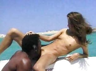 Hot interracial couple enjoy fucking on a boat