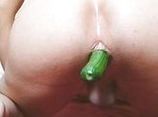 Bottom slut puts a cucumber up his ass