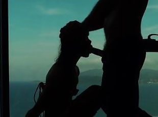 Artistic silhouette - Tied up Asian teen sucking dick with an ocean...