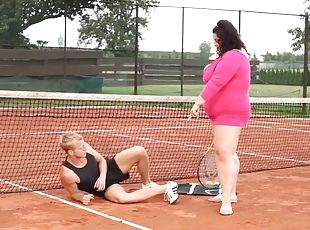 Obese woman facesits on her trainer at the tennis court