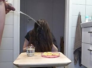 Golden shower on the amateur girl while she is having her breakfast