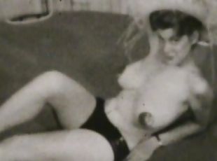 Retro babe shows off her boobs