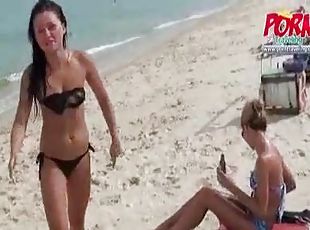 Bikini babes rub lotion on each other