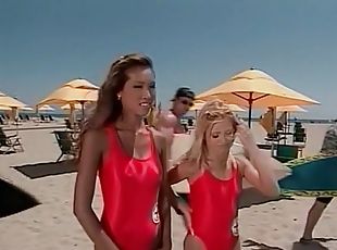 Lifeguard babes in swimsuits have lesbian sex