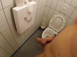 Naked jerking off and cum in the toilet next to a public shower roo...