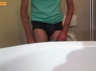 Hairy young man pisses in the toilet (different cameras)