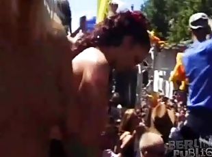 Topless chicks dancing at big outdoor party