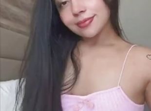 Latina in pink shows her ass