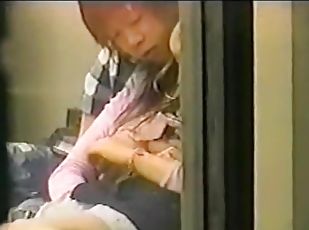 Amateur Asian blowjob filmed through window
