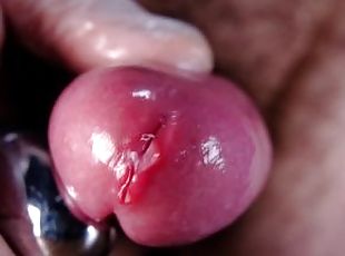 Extreme close up and slow motion of vibrating penis leaking juicy p...